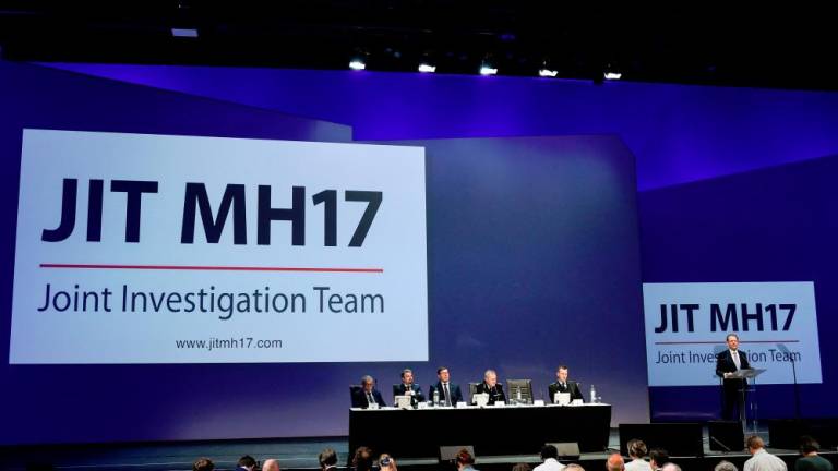 Members of the Joint Investigation Team hold a press conference on June 19, 2019 in Nieuwegein, on the ongoing investigation of the Malaysia Airlines MH17 crash in 2014. — AFP