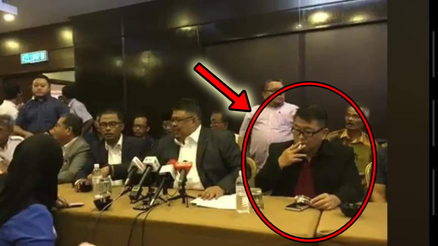 Malacca Exco members smoke during press conference