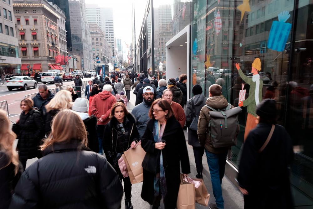 View of an upscale shopping district of Manhattan in New York City on Monday. An economist believes it’s only a matter a time before Fed interest rate hikes and tighter financial conditions push the US economy into a recession– AFPpic