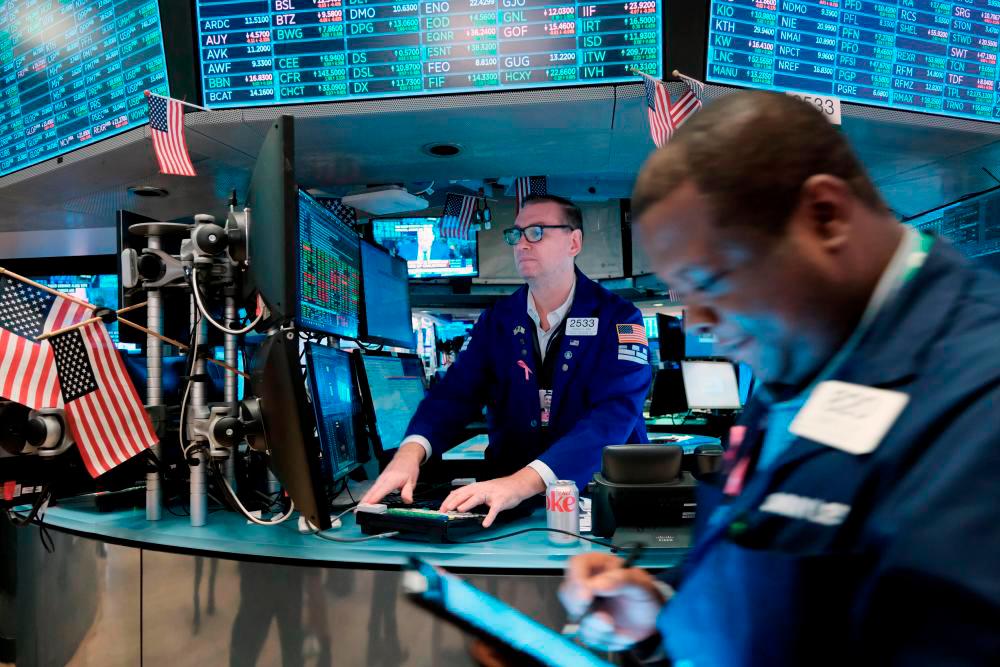 Traders working on the floor of the New York Stock Exchange on Thursday, Oct 27. – AFPpic