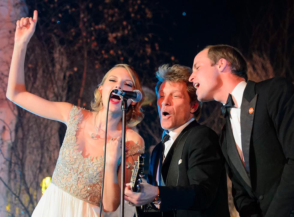 Prince William (right) shares the mic with Swift (left) and Bon Jovi at the Centrepoint Gala Dinner in 2013. — PHOTO COURTESY OF AFP