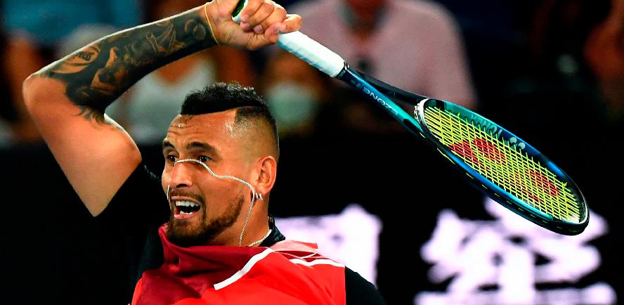 The necklace of Australia’s Nick Kyrgios is seen as he hits a return against Russia’s Daniil Medvedev (unseen) at the Australian Open in Melbourne. – AFPPIX