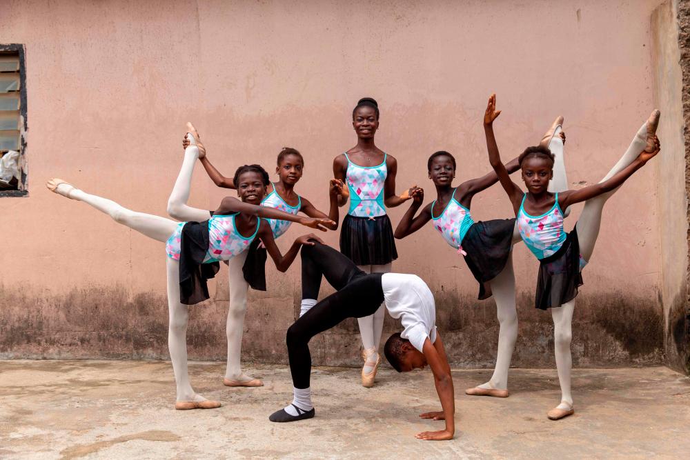 $!Students of the Leap of Dance Academy pose for portrait in at Ajangbadi, Lagos, on July 3, 2020. / AFP / Benson Ibeabuchi