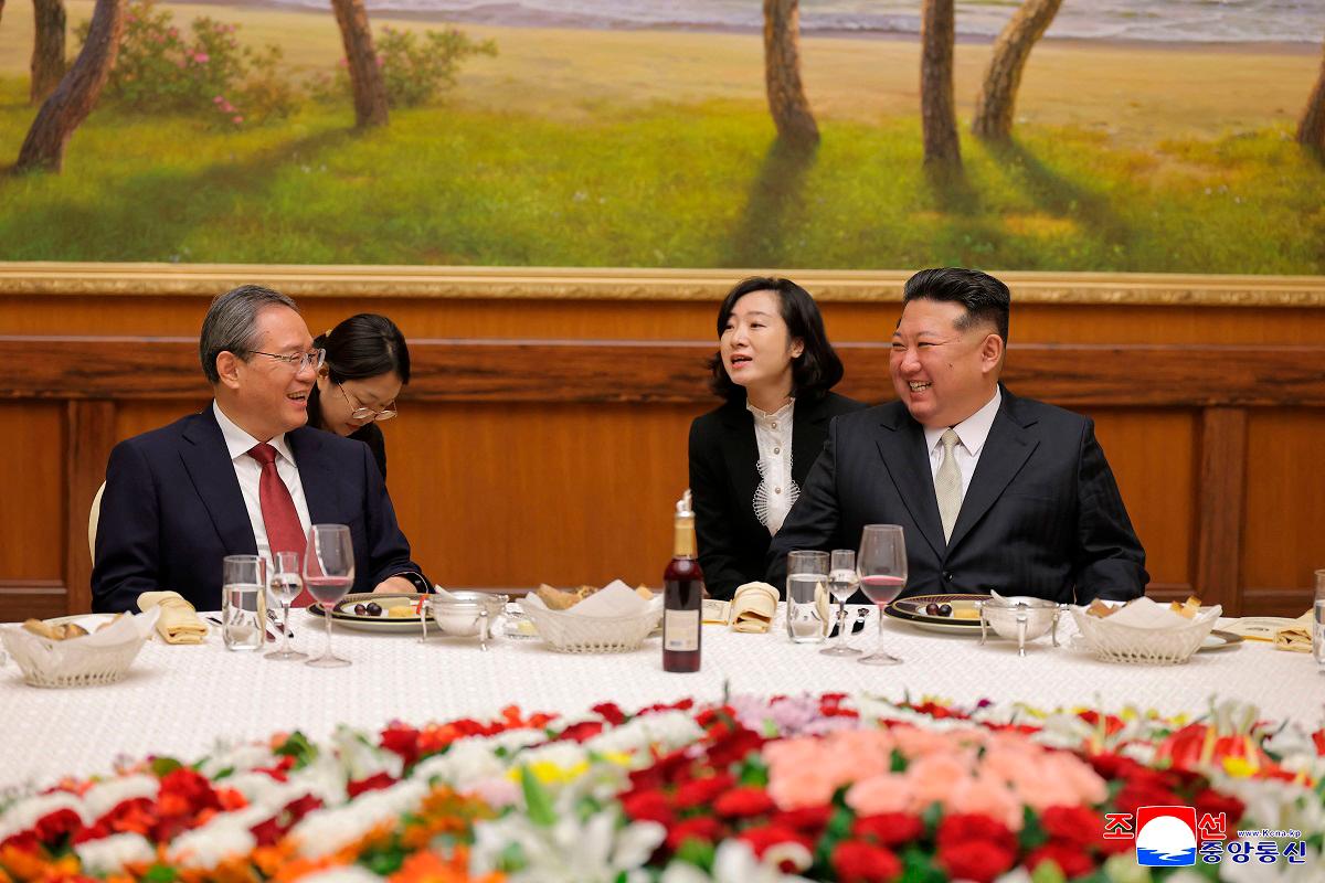 North Korean leader Kim Jong Un (R) speaking with Chinese Premier Li Qiang (L) at the headquarters of the Central Committee of the Workers’ Party of Korea in Pyongyang. - AFP PHOTO/KCNA VIA KNS