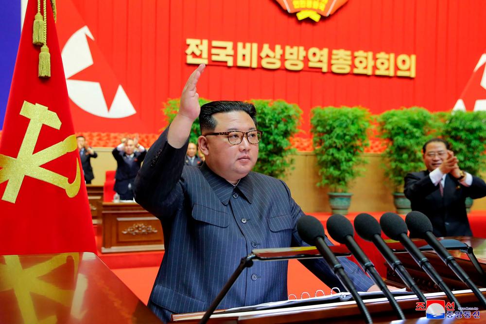 This picture taken on August 10, 2022 and released from North Korea’s official Korean Central News Agency (KCNA) on August 11, 2022 shows North Korean leader Kim Jong Un speaking during the National Meeting of Reviewing Emergency Anti-Epidemic Work in Pyongyang. AFPPIX