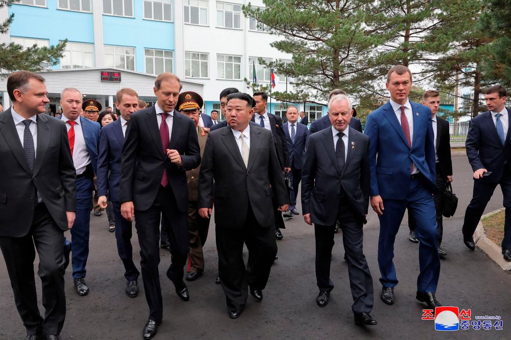 This picture taken on September 15, 2023 and released by North Korea’s official Korean Central News Agency (KCNA) on September 16, 2023 shows North Korean leader Kim Jong Un (C) visiting the Komsomolsk-on-Amur Yuri Gagarin Aviation Plant, in Komsomolsk-on-Amur, a major industrial city in the Far Eastern Region of the Russia. AFPPIX