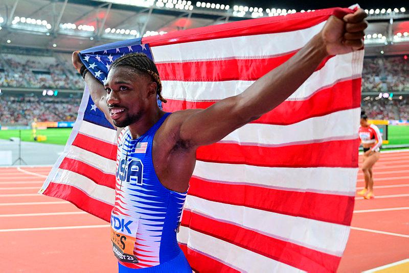 Lyles wins third world gold after anchoring US relay to victory