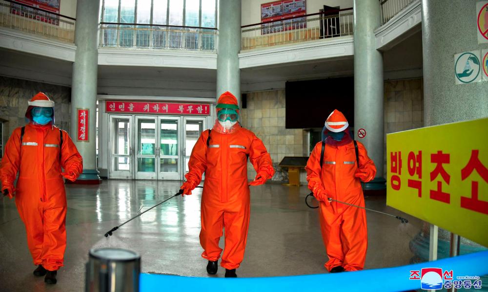 This picture taken on May 17, 2022 and released from North Korea's official Korean Central News Agency (KCNA) on May 18 shows railway station staff disinfecting Pyongyang station premises as a prevention measure against the Covid-19 coronavirus. KCNA VIA KNS/AFPpix