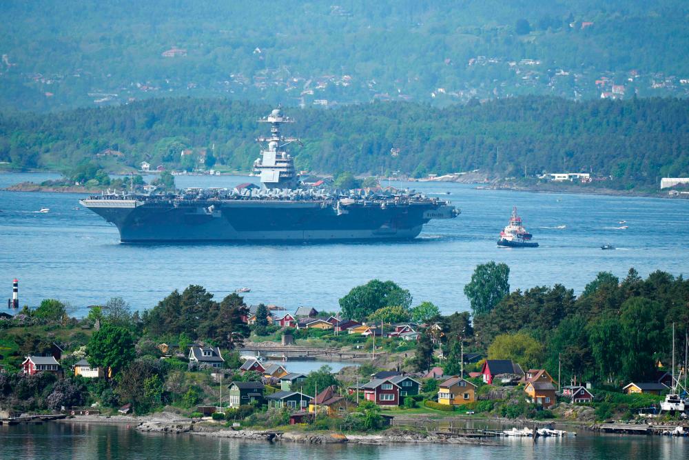 The 337-metre (1,106-foot) USS Gerald R. Ford aircraft carrier of the US Navy is seen in the Oslo Fjord, here seen from Ekebergskrenten in Oslo, Norway, on May 24, 2023. AFPPIX