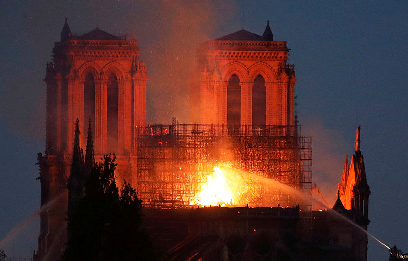 Fire fighters douse flames of the burning Notre Dame Cathedral in Paris, France April 15, 2019. — Reuters
