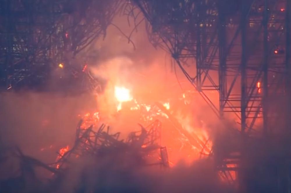 Screenshot of raging fire engulfing Notre Dame.
