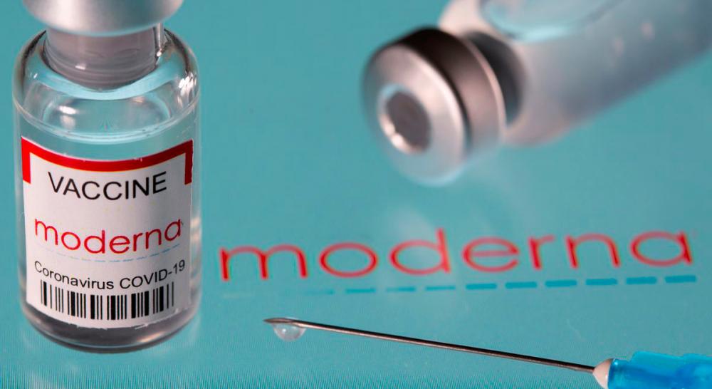 Vial labelled “Moderna coronavirus disease (Covid-19) vaccine” placed on displayed Moderna logo is seen in this illustration picture taken March 24, 2021. -Reuters