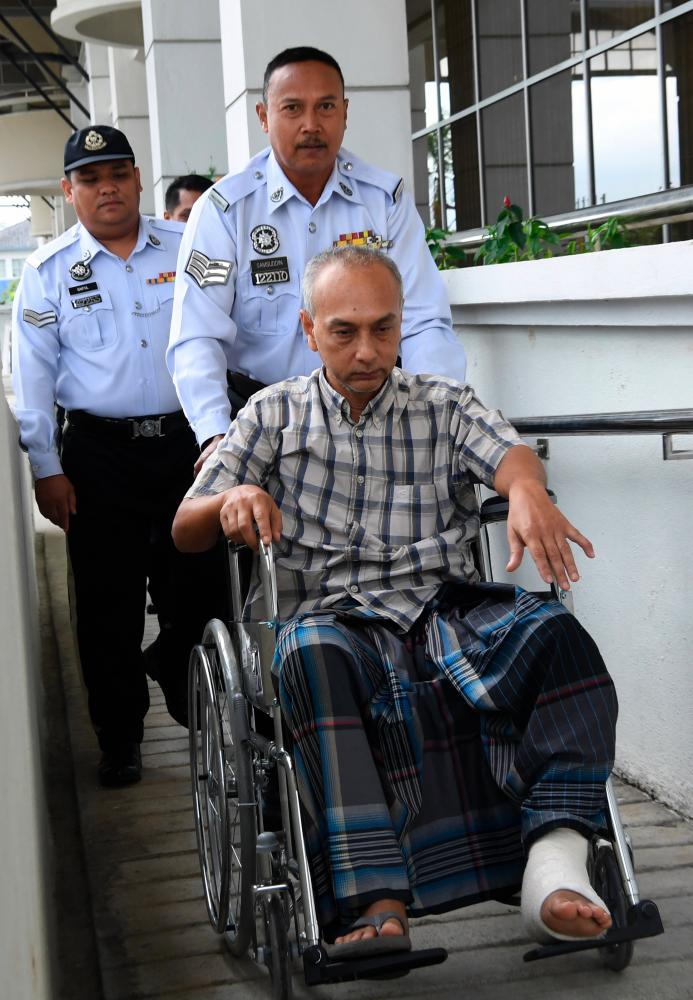Bus driver, Othman Iberahim, 51, (wheelchair) was charged in the Special Traffic Court in Seremban today with nine counts of causing a death and injuring eight others in an accident with a SUV at Jalan Pantai-Bukit Tangga, Nilai, May 23. - Bernama