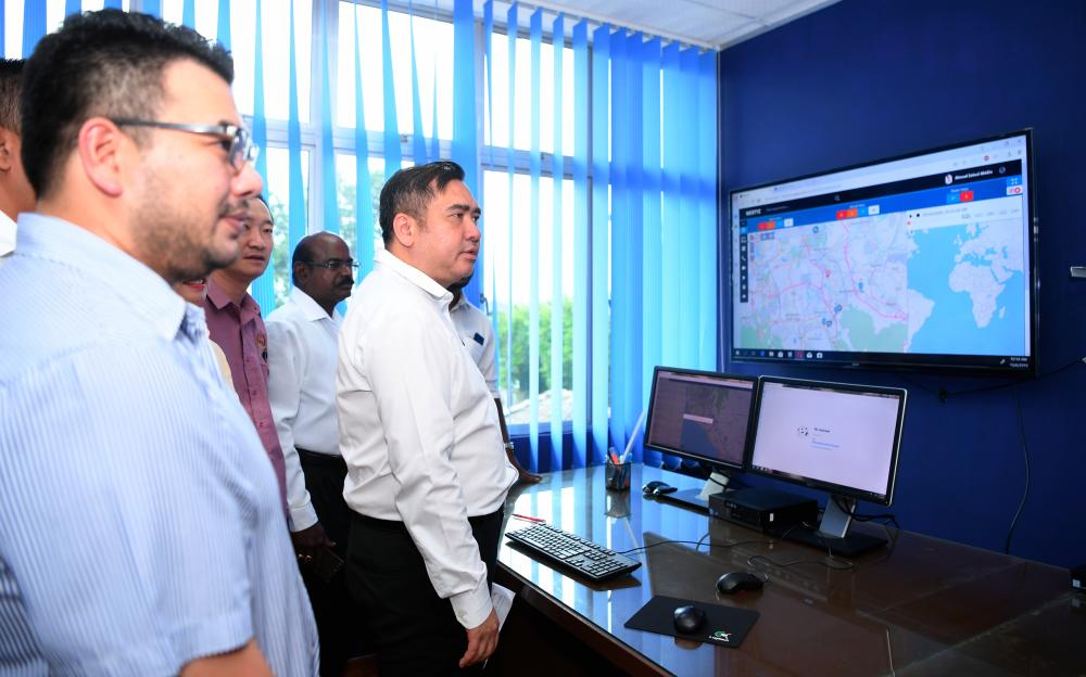 Transport Minister Anthony Loke Siew Fook (R) visits the MyBas Seremban control centre at the Terminal One Seremban bus terminal on June 13, 2019. - Bernama