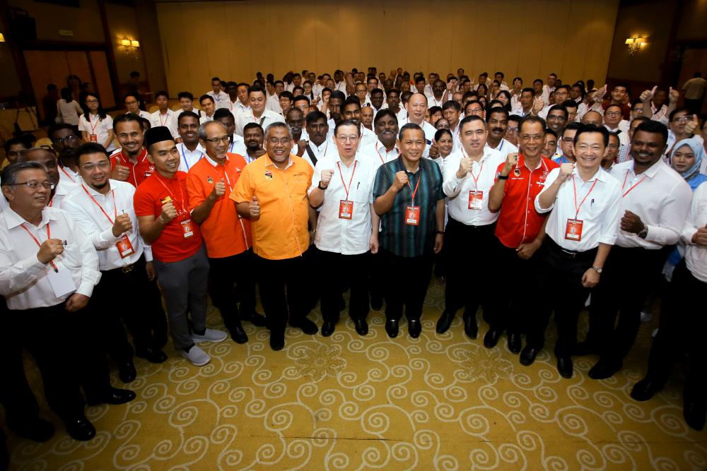 DAP secretary-general Lim Guan Eng (6th L), Negri Sembilan Mentri Besar Datuk Seri Aminuddin Harun (5th R) and state DAP chairman Anthony Loke (4th R), pose for a group photo at the Negri Sembilan DAP annual convention, in Seremban, on Sept 22, 2019. — Bernama