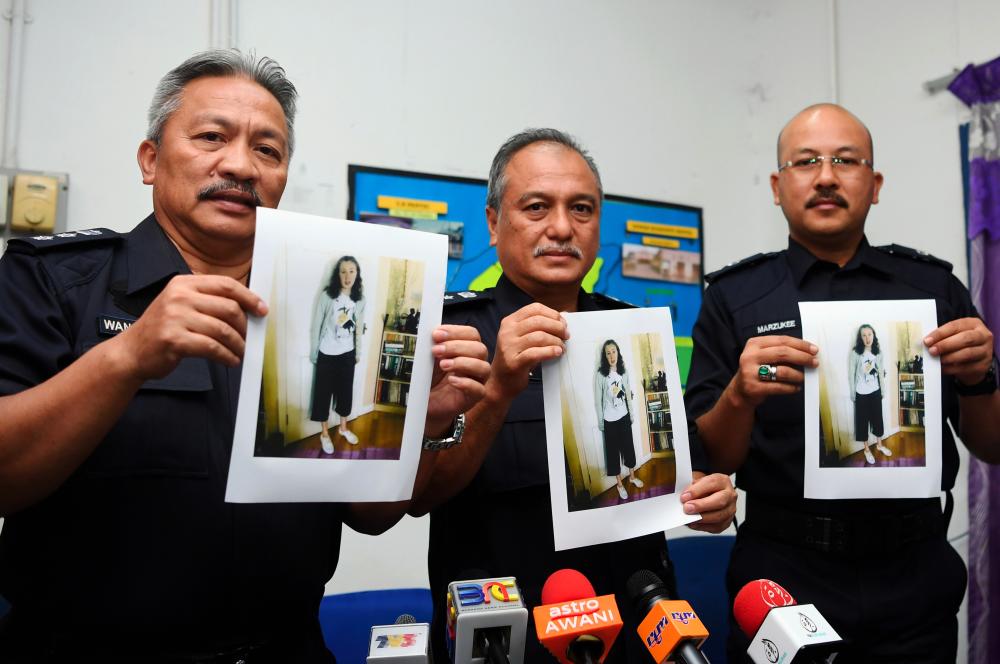 Negri Sembilan police chiefs display pictures of Irish teenager Nora Anne Quoririn, 15, who was reported missing on Sunday, during a press conference on Monday. - Bernama