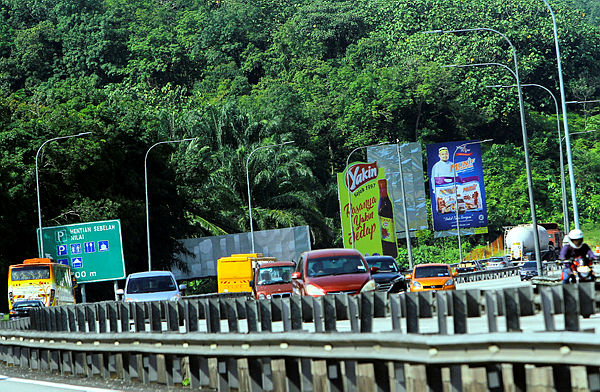 Some of the billboards that have been illegally built, detected by the MPN on the North–South (PLUS) Expressway, today. — Bernama