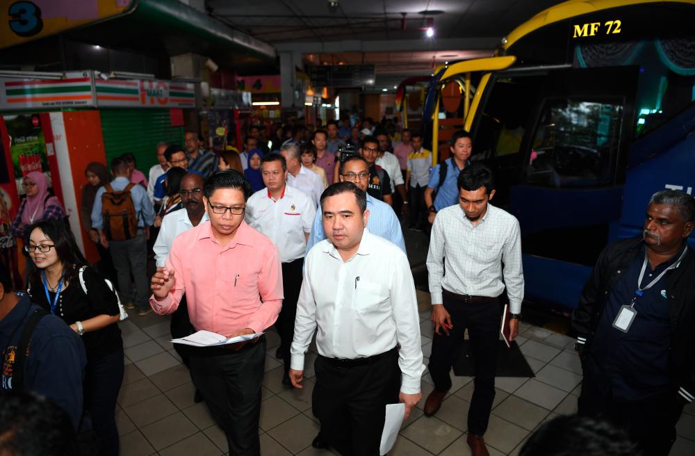 Transport Minister Anthony Loke Siew Fook (C) on his working visit to Seremban Terminal One, Seremban on June 13, 2019. - Bernama