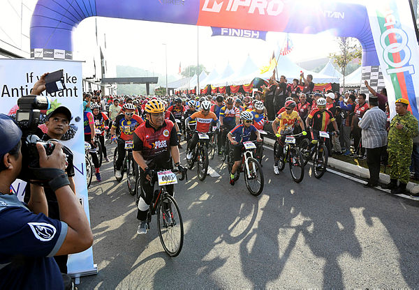 Participants of the cycling event setting off at Negri Sembilan’sNational Sports Month celebration yesterday.