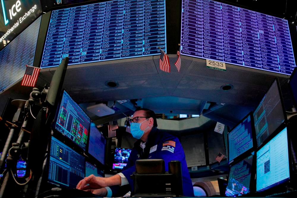 A trader working on the floor of the New York Stock Exchange. Wall Street rose again yesterday on a Big Tech boost. REUTERSpix