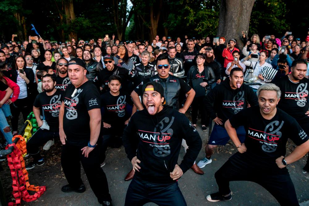 Members of different biker gangs perform the haka as a tribute to victims in Christchurch on March 20, 2019, five days after the twin mosque shootings. — AFP