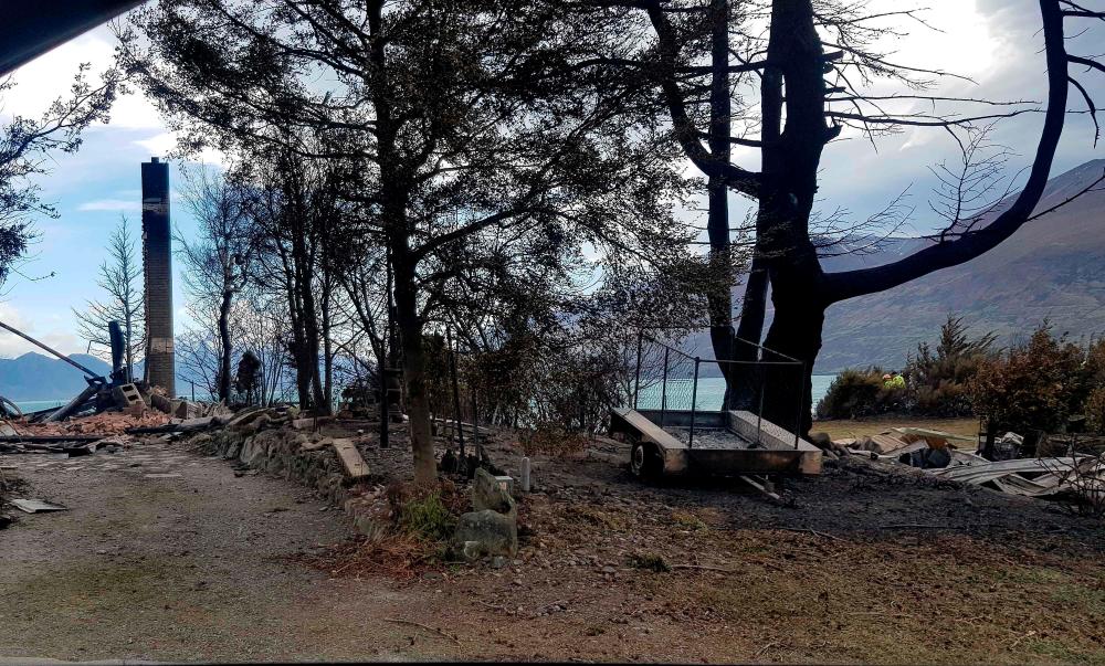 This handout photo taken on October 6, 2020 courtesy of Gary Kircher shows damage caused by the South Island wildfires in Lake Ohau. — AFP