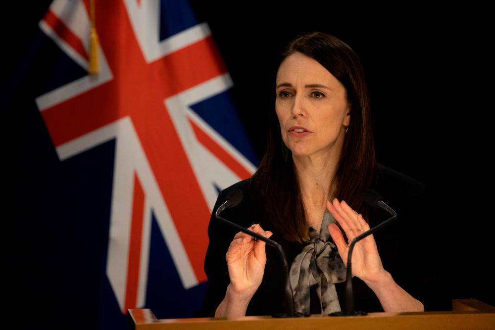 New Zealand’s Prime Minister Jacinda Ardern speaks to media regarding the latest case of Covid-19 coronavirus infections, breaking a 102-day run of no local transmissions, at the parliament in Auckland on August 12, 2020. — AFP
