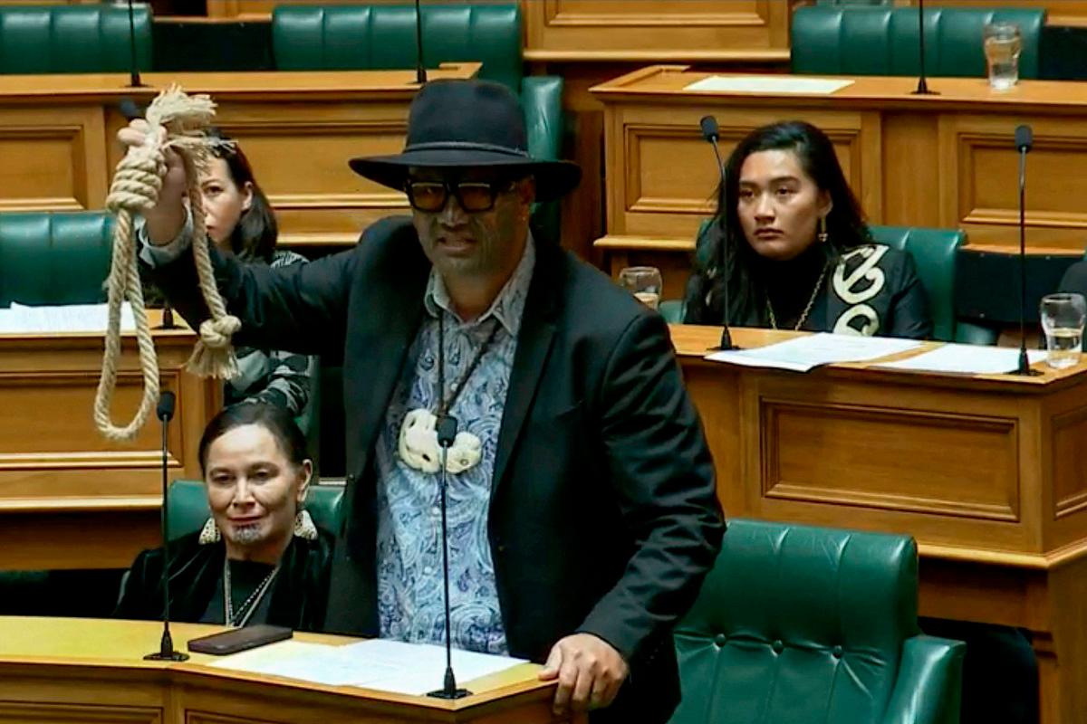 This screen grab taken from video released by the New Zealand Parliament on June 5, 2025 shows Maori Party co-leader Rawiri Waititi holding a noose while speaking at the parliament in Wellington. New Zealand's Parliament on June 5 handed record bans to three indigenous Maori lawmakers, including Rawiri Waititi, who last year staged a protest haka on the debating floor. - AFP PHOTO / NEW ZEALAND PARLIAMENT