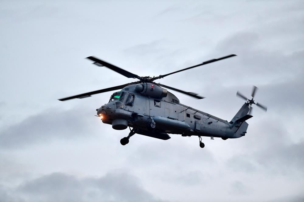 A second airforce helicopter arrives at Whakatane airport to help with the removal of the 8 bodies of those lost in the December the 9th White Island eruption, in New Zealand, on Dec 13. — AFP