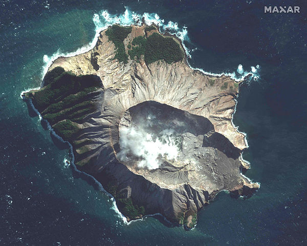 This handout image courtesy of Satellite image ©2019 Maxar Technologies, shows the White Island volcano in New Zealand on May 12, 2019. The smouldering New Zealand volcano that killed at least six people is still too dangerous for emergency teams to recover bodies from, police said Wednesday, warning that many tourists who escaped the island were so badly burned they were not yet out of danger — AFP