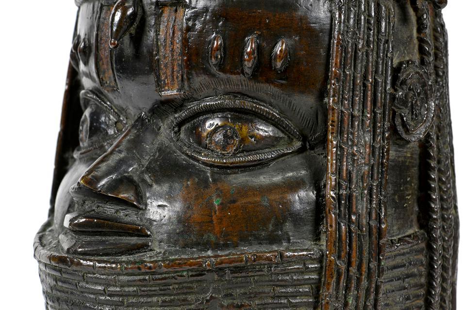 Detail of a bronze sculpture depicting an Oba (king) of Benin is seen in this handout photo taken at the Sir Duncan Rice Library at the University of Aberdeen, Scotland, Britain, March, 2021. Kalyan Veera/Handout via REUTERSpix