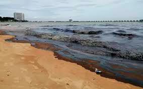 The oil spill at port Dickson beach.-Bernama