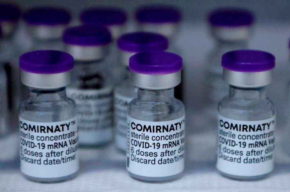 Vials of the Pfizer-BioNTech Comirnaty coronavirus disease (Covid-19) vaccine are pictured in a General practitioners practice in Berlin, Germany, April 10, 2021. REUTERSpix