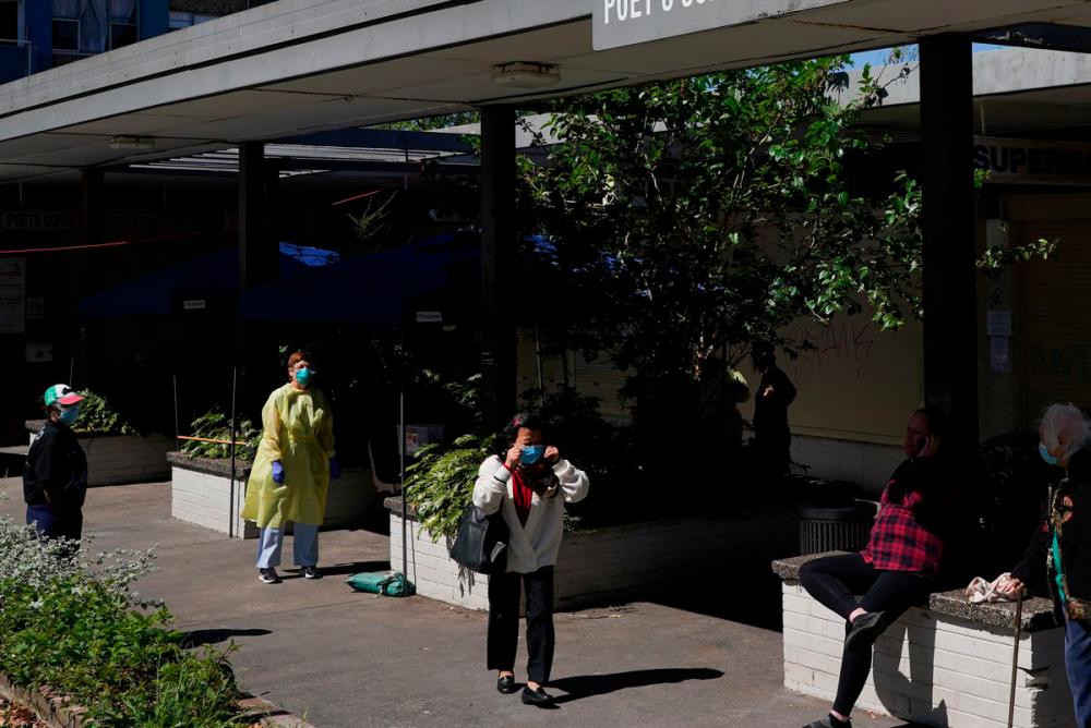 A health worker is stationed at a coronavirus disease (Covid-19) testing clinic set up for residents of surrounding public housing towers in the Redfern suburb, where authorities are working to contain an emerging cluster of cases, as widespread lockdown continues in Sydney, Australia, September 17, 2021. -REUTERSPix