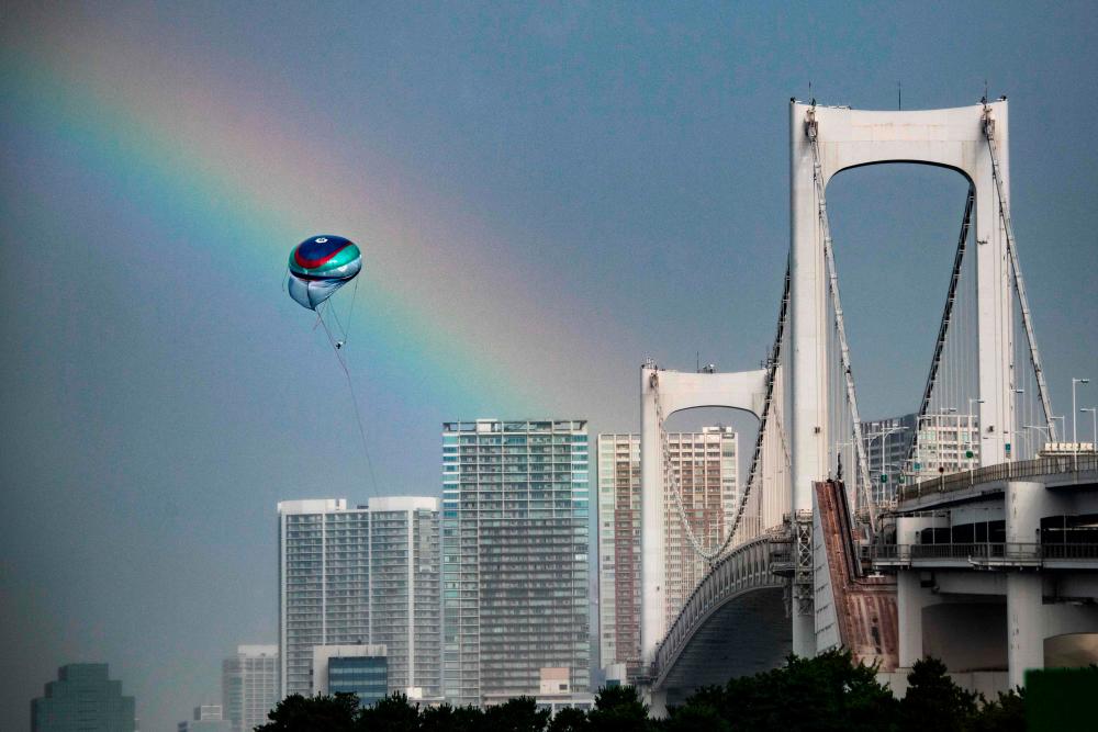 A rainbow is seen during the Tokyo 2020 Olympic Games at the Odaiba Marine Park in Tokyo on July 27, 2021, as Tropical Storm Nepartak approached Japan’s northeast coast. -AFP