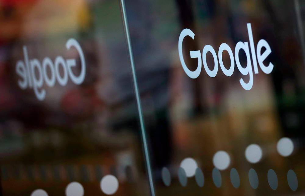 The Google logo is pictured at the entrance to the Google offices in London. – REUTERSPIX