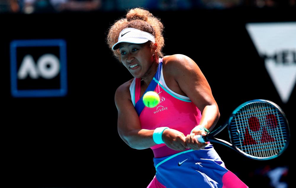 Tennis - Australian Open - Melbourne Park, Melbourne, Australia - January 17, 2022 Japan's Naomi Osaka in action during her first round match against Colombia's Camila Osorio. REUTERSPix