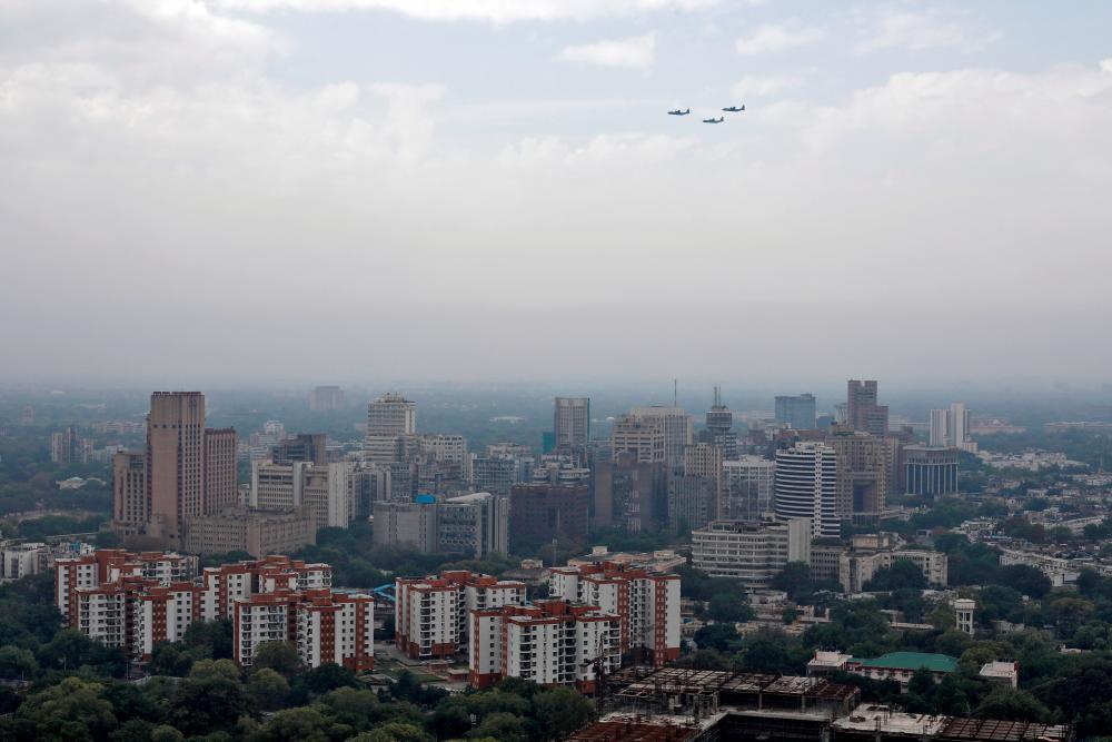 Indian Air Force (IAF) planes fly past New Delhi skyline as part of an activity being carried out by the IAF to show gratitude towards the frontline workers fighting the coronavirus disease outbreak, in New Delhi, India, May 3, 2020. - Reuters