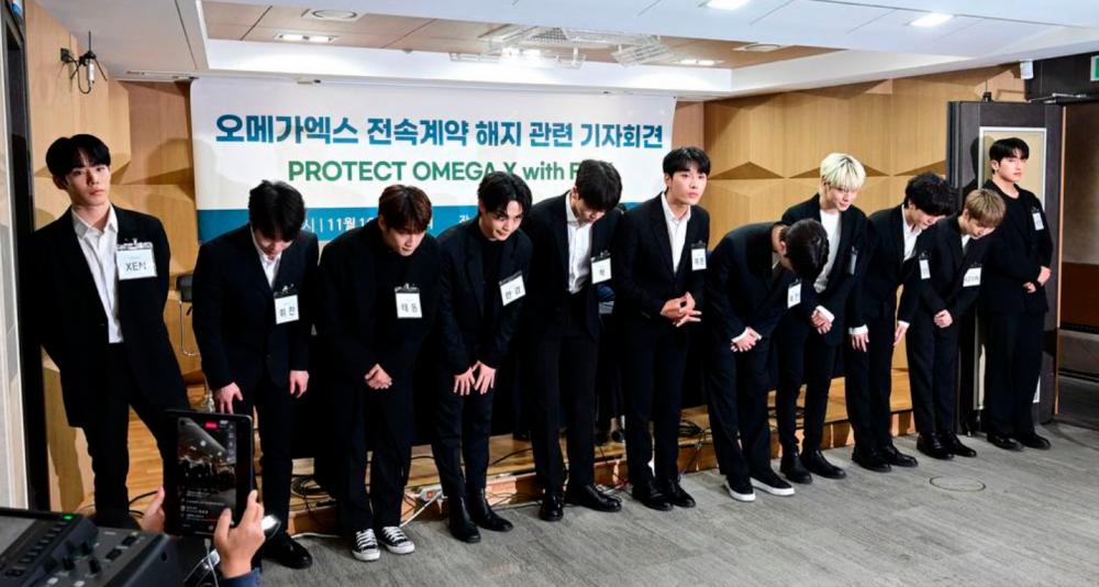Members of OMEGA X during their press conference. – Koreaboo