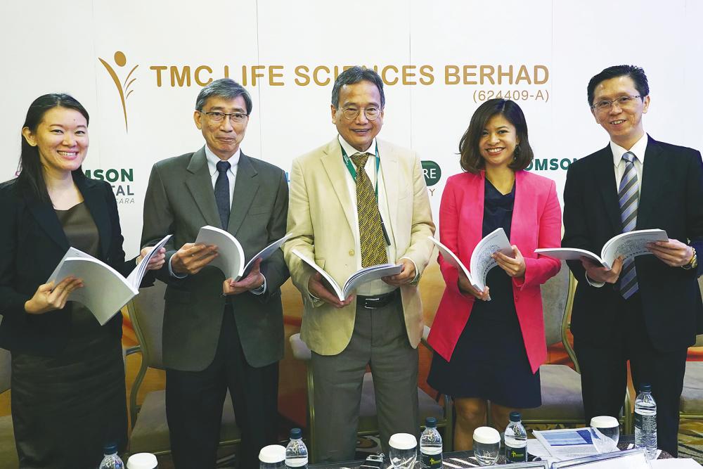 From left: TMC Women Specialist Holdings Sdn Bhd CEO Irene Kwan Yee Man, TMC Life Sciences executive director Barry Kan Kheong Ng, chairman Prof Emeritus Datuk Dr Khalid Abdul Kadir, Nadiah and Wong. – NORMAN HIU/theSun