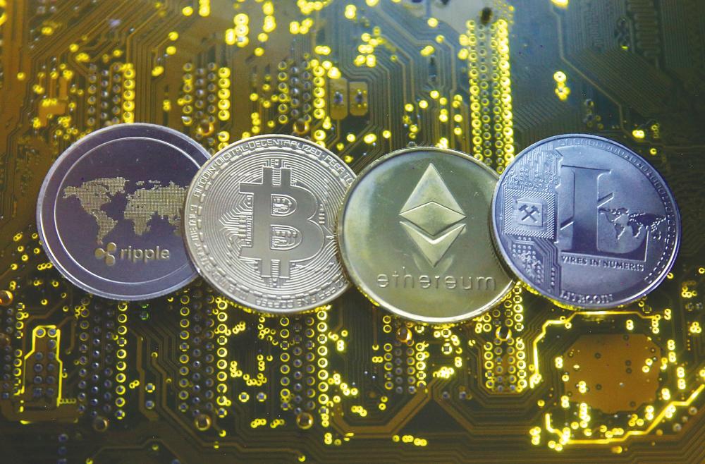 Representations of major cryptocurrencies are seen in this illustration. Investor interest in digital assets remains high despite the recent volatility. – REUTERSPIX