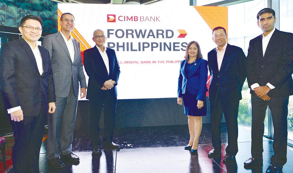 From left: CIMB Bancom Capital Corp CEO Paolo Azurin, CIMB Group chief strategy and design officer Gurdip Singh, chairman Datuk Mohd Nasir Ahmad, Bangko Sentral ng Pilipinas deputy governor Chuchi G Fonacier, Effendy and Vijay after the launch of CIMB’s all-digital bank in Manila yesterday.