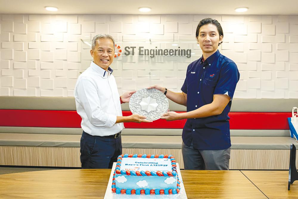 ST Engineering EVP &amp; head of aviation asset management Yip Hin Meng (left) and Mohamad Najib commemorating the announcement.
