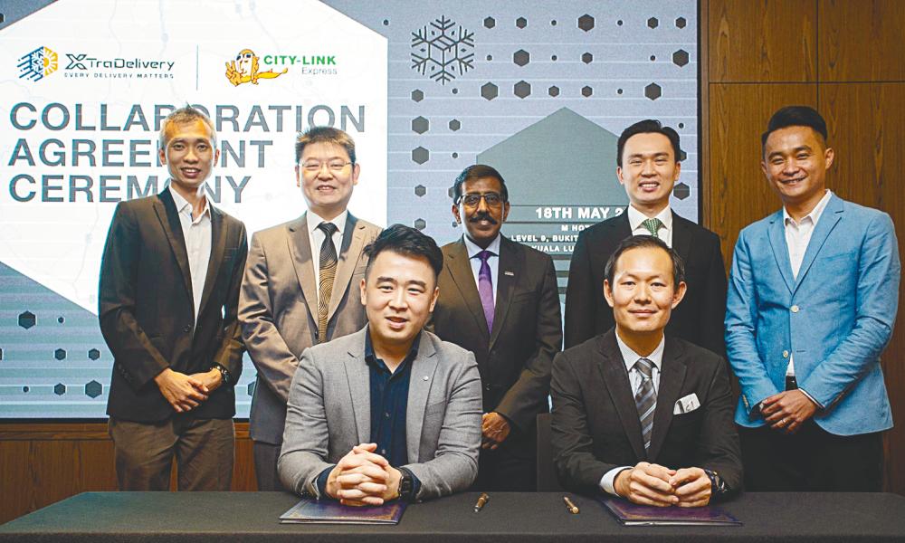 From left: XTRA Delivery founder and CTO Ken Lee Chiaw Huat, XL Holdings executive chairman Stephen Ng Min Lin, Mida investment promotion and facilitation deputy CEO Sivasuriyamoorthy Sundara Raja, City-Link Express CEO Ronald Tan, XTRA Delivery COO Zen Chua Hat Zen at the signing ceremony.