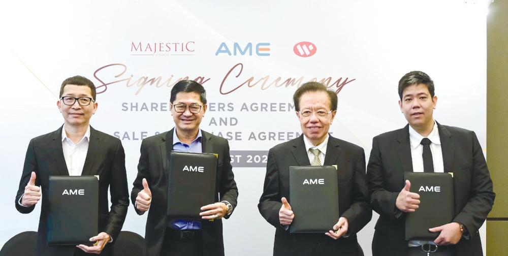 From left: AME Elite executive director Simon Lee, Kelvin, Waz Lian Group chairman Tan Sri Ta Kin Yan and Majestic Builders director Ta Wee Dher at the signing ceremony.