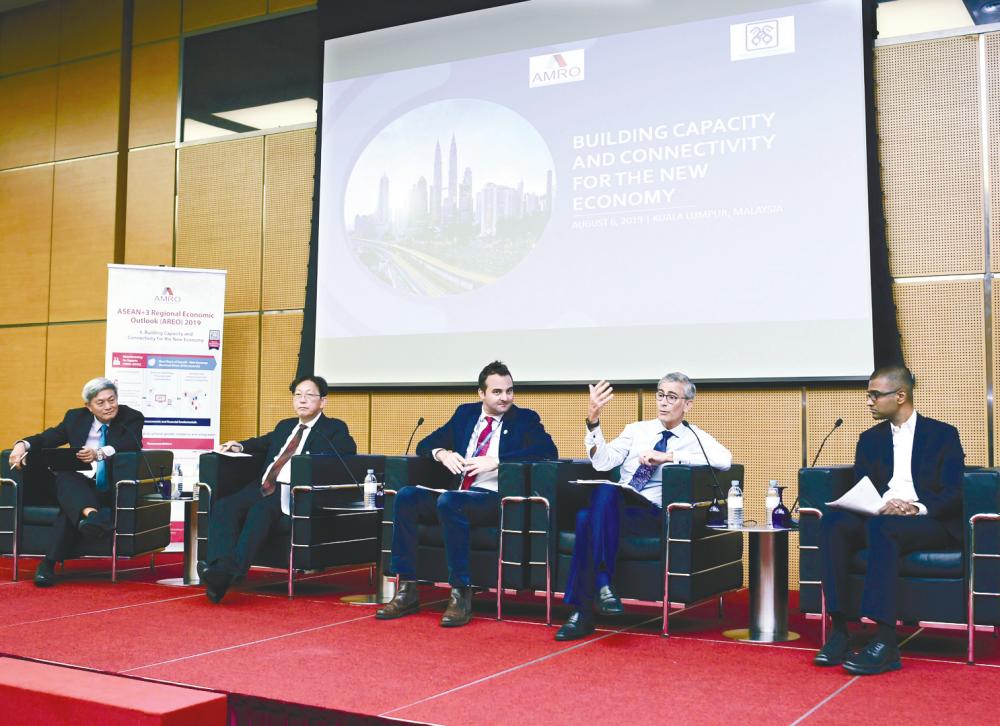 Malaysian Economic Association deputy president Prof Dr Yeah Kim Leng (left), who is the moderator, together with panelists (from left) Khor, World Bank lead economist, macroeconomics, trade and investment global practice Dr Richard Record, Hanna and Digi Telecommunications chief digital officer Praveen Rajan during the briefing. – BERNAMAPIX