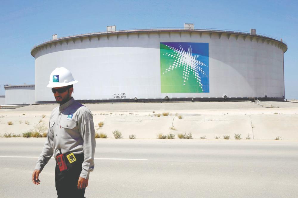 An Aramco employee walks near an oil tank at Saudi Aramco’s Ras Tanura oil refinery and oil terminal in Saudi Arabia. – REUTERSPIX