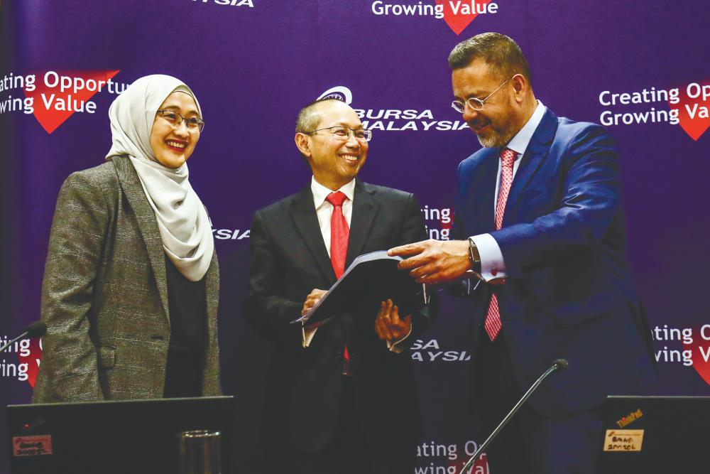 From left: Rosidah, Bursa Malaysia chairman Tan Sri Abdul Wahid Omar and Umar at the press conference. – HAFIZ SOHAIMI/THESUN