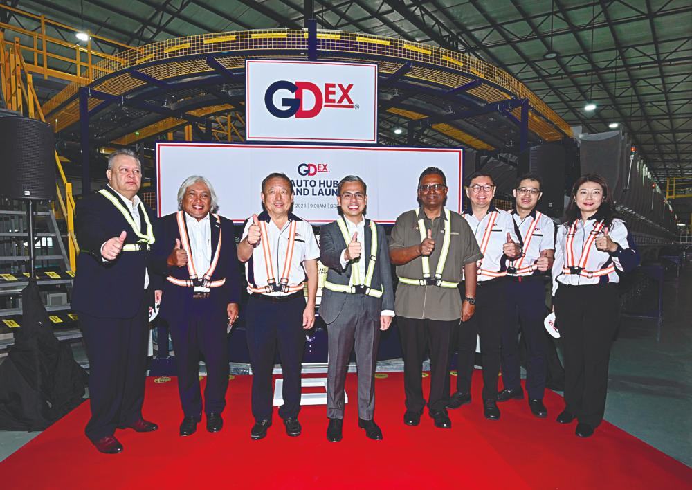 From left: Malaysian Communications and Multimedia Commission chairman Tan Sri Mohamad Salim Fateh Din, Gdex chairman Tan Sri Muhammad Ibrahim, Teong, Fahmi, Ministry of Communications and Digital deputy chief secretary Ma. Sivanesan Marimuthu, Gdex CFO Lim Chee Seong, chief investment officer Jerry Lee, and COO Caren Chong at the event.
