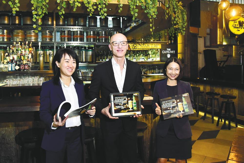 From left: Carlsberg Malaysia’s corporate affairs and sustainability director Pearl Lai, Clini, and Gun after the AGM. – sunpix